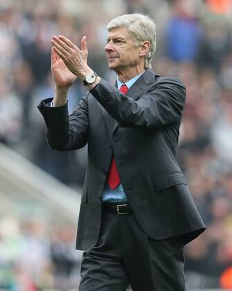Football - English Premiership - Newcastle v Arsenal Arsesnal manager Arsene Wenger celebrates securing Champions League football during the Newcastle v Arsenal, Barclay s Premier League football match at St James Park, Newcastle. Colorsport 19th May 2013