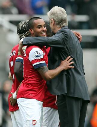Football - English Premiership - Newcastle v Arsenal Aresnal manager Arsene Wenger hugs Theo Walcott during the Newcastle v Arsenal, Barclay s Premier League football match at St James Park, Newcastle. Colorsport 19th May 2013