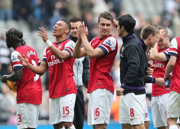 Alex Oxlade-Chamberlain, Aaron Ramsey, Football - English Premiership - Newcastle United v Arsenal FC Arsesnal players celebrate securing Champions League football during the Newcastle United v Arsenal FC , Barclay s Premier League football match at St James Park, Newcastle. Colorsport 19th May 2013 