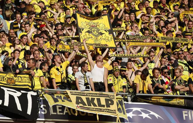Dortmund s fans cheer for their side - Borussia Dortmund - UEFA Champions League Final - Wembley Stadium - London - England -25 05 2013 - EDITORIAL USE ONLY. No use with unauthorised audio, video, data, fixture lists, club league logos or live services. Online in-match use limited to 120 images, no video emulation. No use in betting, games or single club league player publications.