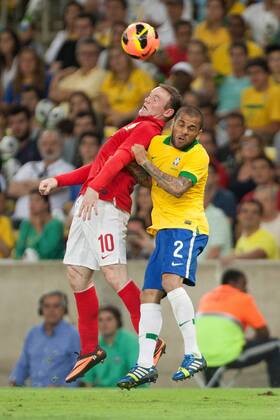 Football - International Friendly - Brazil vs. England Wayne Rooney of England and Daniel Alves da Silva of Brazil at the Maracana Stadium, Rio de Janeiro