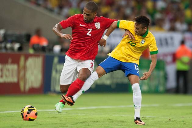 Football - International Friendly - Brazil vs. England Neymar of Brazil challenges Glen Johnson of England at the Maracana Stadium, Rio de Janeiro