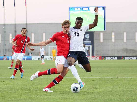 England s Wilfred Zaha tussles with Norway s Thomas Rogne - England U21 vs Norway U21 - UEFA U21 Championship 2013 - Ha Moshava Stadium - Petah Tikva - Israel - 08 06 2013 - Pic David Klein Sportimage EDITORIAL USE ONLY. No use with unauthorised audio, video, data, fixture lists, club league logos or live services. Online in-match use limited to 120 images, no video emulation. No use in betting, games or single club league player publications.