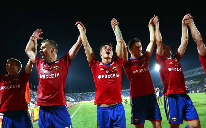 ITAR-TASS: ROSTOV-ON-DON, RUSSIA. JULY 13, 2013. CSKA s players celebrate as they win a match for the Russian Football Super Cup against Zenit St. Petersburg at the Olimp-2 Stadium. FC CSKA won the game 3:0.  RE121C31