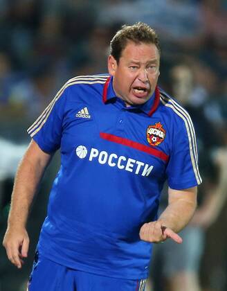 ITAR-TASS: ROSTOV-ON-DON, RUSSIA. JULY 13, 2013. CSKA s head coach Leonid Slutsky instructs his players in a match for the Russian Football Super Cup against Zenit St. Petersburg at the Olimp-2 Stadium. FC CSKA won the game 3:0.  RE121BEA