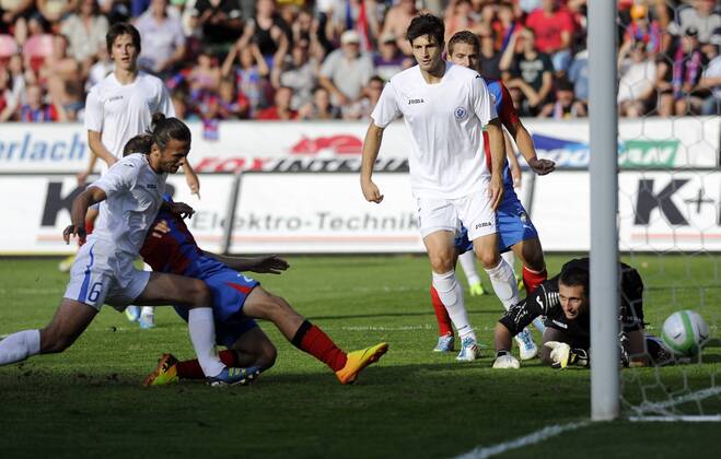Opening match of Champions League, 2nd preliminary round, Viktoria Plzen vs FK Zeljeznicar Sarajevo in Pilsen, Czech Republic, July 16, 2013. Daniel Kolar (left back) of Viktoria shoots a goal to the goalkeeper of sarajevo Asim Skaljic. (CTKxPhoto PetrxEret) CTKPhotoP201307160743101  ert 4