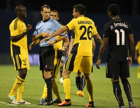 Zagreb, 30.7.2013. - UEFA Champions League 2013 2014, Third Qualifying Round, Stadium Maksimir. GNK Dinamo (blue) - FC Sheriff (yellow). Carlos Clos Gomes and William Celestino Da Silva, Miral Samardzic GNK Dinamo - FC Sheriff
