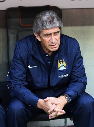 Manchester City s Manuel Pellegrini looks on AC Milan v Manchester City - Audi Cup - Allianz Arena - Munich - Germany -31 07 2013 - Pic David Klein Sportimage EDITORIAL USE ONLY. No use with unauthorised audio, video, data, fixture lists, club league logos or live services. Online in-match use limited to 120 images, no video emulation. No use in betting, games or single club league player publications.