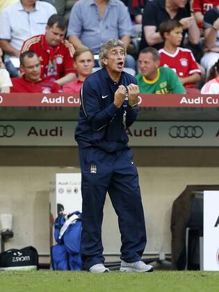 Manchester City s Manuel Pellegrini looks on AC Milan v Manchester City - Audi Cup - Allianz Arena - Munich - Germany -31 07 2013 - Pic David Klein Sportimage EDITORIAL USE ONLY. No use with unauthorised audio, video, data, fixture lists, club league logos or live services. Online in-match use limited to 120 images, no video emulation. No use in betting, games or single club league player publications.