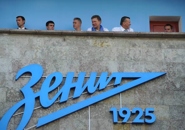 ITAR-TASS: ST PETERSBURG, RUSSIA. AUGUST 7, 2013. Gazprom chief Alexei Miller (4th L) and chariman of the board at Gazprom, Viktor Zubkov (5th L) watch action in the second leg of a UEFA Champions League third qualifying round football match between Zenit St Petersburg and FC Nordsjaelland (Denmark) at Petrovsky Stadium. Zenit won the game 5-0.  premiumd RE124A79