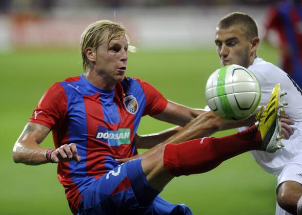 Second leg match of Champions League, 3nd preliminary round, FC Viktoria Plzen vs Nomme Kalju in Pilsen, Czech Republic, August 7, 2013. Frantisek Rajtoral (left) of Plzen and Ken Kallaste of Kalju. (CTKxPhoto PetrxEret) CTKPhotoP201308070912501  ert 8