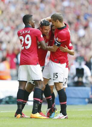 Manchester United s Robin Van Persie celebrates scoring his sides opening goal Manchester United v Wigan Athletic - FA Community Shield - Wembley - London - England -11 08 2013 - Pic David Klein Sportimage EDITORIAL USE ONLY. No use with unauthorised audio, video, data, fixture lists, club league logos or live services. Online in-match use limited to 120 images, no video emulation. No use in betting, games or single club league player publications.