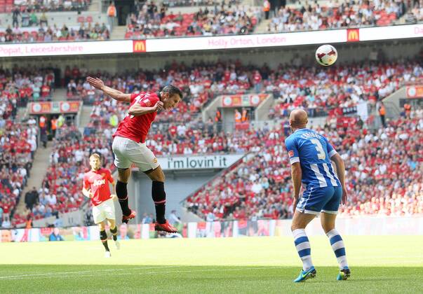 Manchester United s Robin Van Persie scoring his sides opening goal Manchester United v Wigan Athletic - FA Community Shield - Wembley - London - England -11 08 2013 - Pic David Klein Sportimage EDITORIAL USE ONLY. No use with unauthorised audio, video, data, fixture lists, club league logos or live services. Online in-match use limited to 120 images, no video emulation. No use in betting, games or single club league player publications.