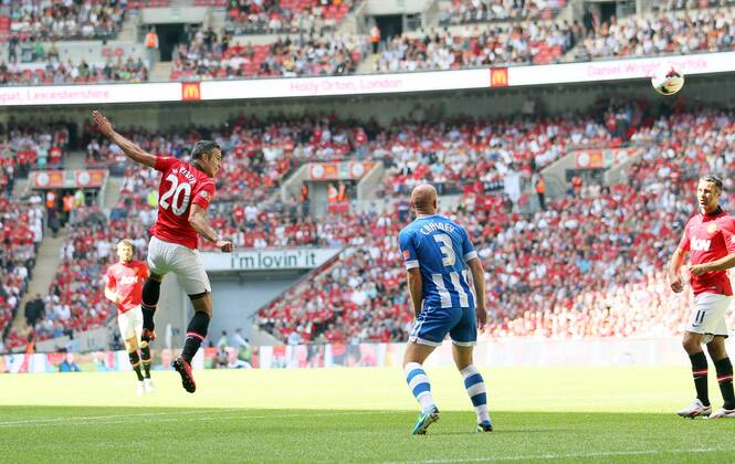 Manchester United s Robin Van Persie scoring his sides opening goal Manchester United v Wigan Athletic - FA Community Shield - Wembley - London - England -11 08 2013 - Pic David Klein Sportimage EDITORIAL USE ONLY. No use with unauthorised audio, video, data, fixture lists, club league logos or live services. Online in-match use limited to 120 images, no video emulation. No use in betting, games or single club league player publications.