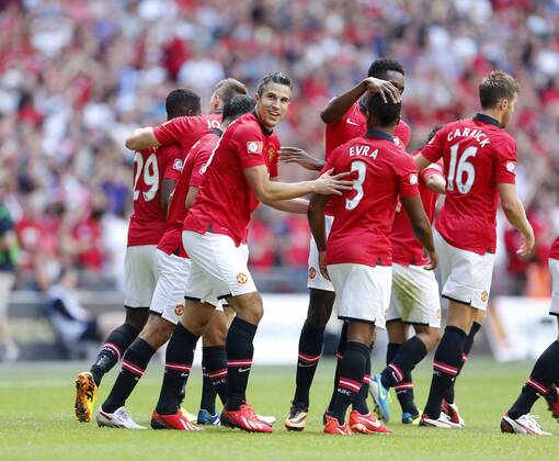 Manchester United s Robin Van Persie celebrates scoring his sides opening goal Manchester United v Wigan Athletic - FA Community Shield - Wembley - London - England -11 08 2013 - Pic David Klein Sportimage EDITORIAL USE ONLY. No use with unauthorised audio, video, data, fixture lists, club league logos or live services. Online in-match use limited to 120 images, no video emulation. No use in betting, games or single club league player publications.
