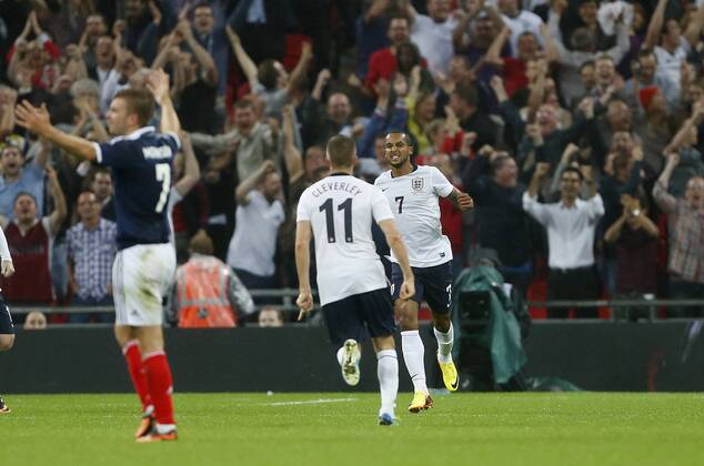 England s Theo Walcott celebrates scoring his sides opening goal England v Scotland - International Friendly - Wembley - London - England -14 08 2013 - Pic DavidxKlein Sportimage EDITORIAL USE ONLY. No use with unauthorised audio, video, data, fixture lists, club league logos or live services. Online in-match use limited to 120 images, no video emulation. No use in betting, games or single club league player publications.