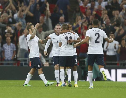 England s Theo Walcott celebrates scoring his sides opening goal England v Scotland - International Friendly - Wembley - London - England -14 08 2013 - Pic DavidxKlein Sportimage EDITORIAL USE ONLY. No use with unauthorised audio, video, data, fixture lists, club league logos or live services. Online in-match use limited to 120 images, no video emulation. No use in betting, games or single club league player publications.