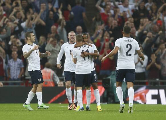 England s Theo Walcott celebrates scoring his sides opening goal England v Scotland - International Friendly - Wembley - London - England -14 08 2013 - Pic DavidxKlein Sportimage EDITORIAL USE ONLY. No use with unauthorised audio, video, data, fixture lists, club league logos or live services. Online in-match use limited to 120 images, no video emulation. No use in betting, games or single club league player publications.