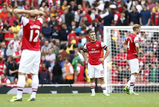Arsenal s Jack Wilshere looks on dejected after going 3-1 downw - FC Arsenal London vs Aston Villa FC - Barclays Premiership - Emirates Stadium - London - England -17 08 2013 - EDITORIAL USE ONLY. No use with unauthorised audio, video, data, fixture lists, club league logos or live services. Online in-match use limited to 120 images, no video emulation. No use in betting, games or single club league player publications.