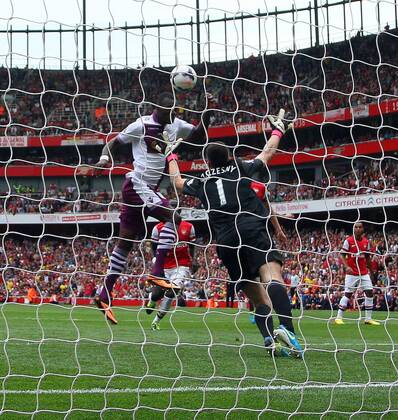 Arsenal FC London v Aston Villa . . London, UK . . 17.08.2013 Christian Benteke (AV) has his penalty kick saved by Wojciech Szczesny(A) but scored the goal on the rebound. 1-1