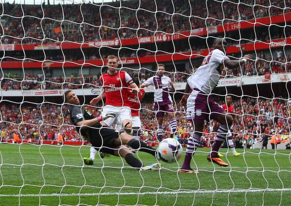 Arsenal FC London v Aston Villa . . London, UK . . 17.08.2013 Christian Benteke (AV) has his penalty kick saved by Wojciech Szczesny(A) but scored the goal on the rebound. 1-1