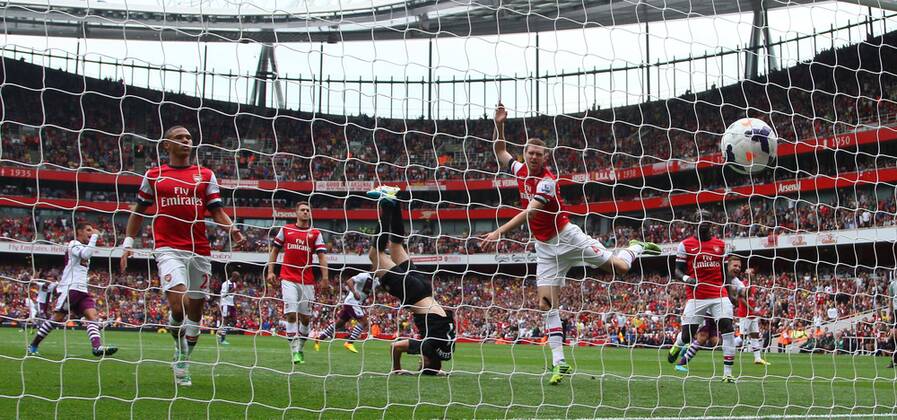 Arsenal FC London v Aston Villa . . London, UK . . 17.08.2013 Christian Benteke (AV) has his penalty kick saved by Wojciech Szczesny(A) but scored the goal on the rebound. 1-1