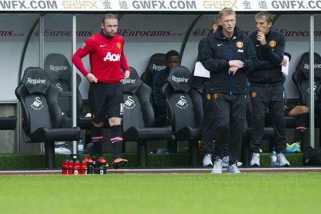 Football - 2013 2014 Premier League - Swansea City vs. Manchester United (ManU) wayne rooney next to david moyestakes the field as sub at Liberty Stadium.