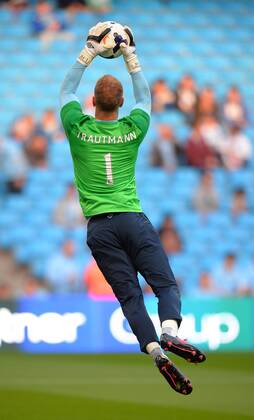 Joe Hart of Manchester City wears a shirt in honour of City hero goalkeeper Bert Trautmann - Barclays Premier League - Manchester City vs Newcastle Utd - Etihad Stadium - Manchester - England - 19 08 13 - Picture Simon Bellis Sportimage EDITORIAL USE ONLY. No use with unauthorised audio, video, data, fixture lists, club league logos or live services. Online in-match use limited to 120 images, no video emulation. No use in betting, games or single club league player publications.