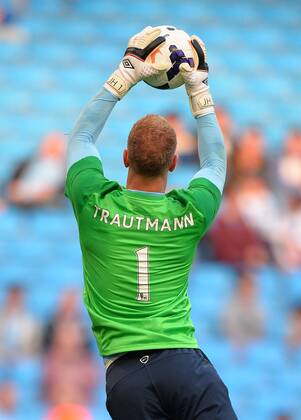 Joe Hart of Manchester City wears a shirt in honour of City hero goalkeeper Bert Trautmann - Barclays Premier League - Manchester City vs Newcastle Utd - Etihad Stadium - Manchester - England - 19 08 13 - Picture Simon Bellis Sportimage EDITORIAL USE ONLY. No use with unauthorised audio, video, data, fixture lists, club league logos or live services. Online in-match use limited to 120 images, no video emulation. No use in betting, games or single club league player publications.