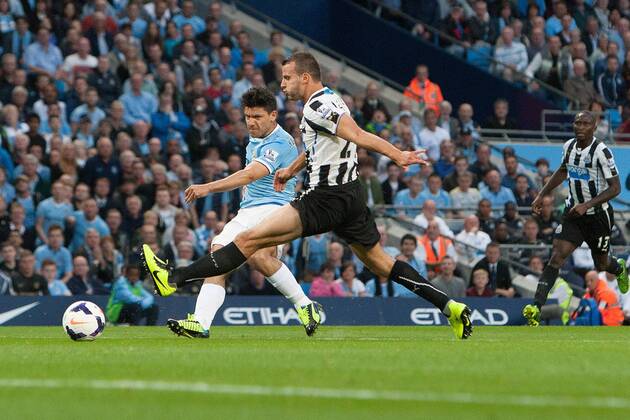 Sergio Aguero of Manchester City scores his sides second goal - Manchester City vs. Newcastle United - Premier League - Etihad Stadium - Manchester - 19 08 2013 Pic Philip Oldham Sportimage EDITORIAL USE ONLY. No use with unauthorised audio, video, data, fixture lists, club league logos or live services. Online in-match use limited to 120 images, no video emulation. No use in betting, games or single club league player publications.