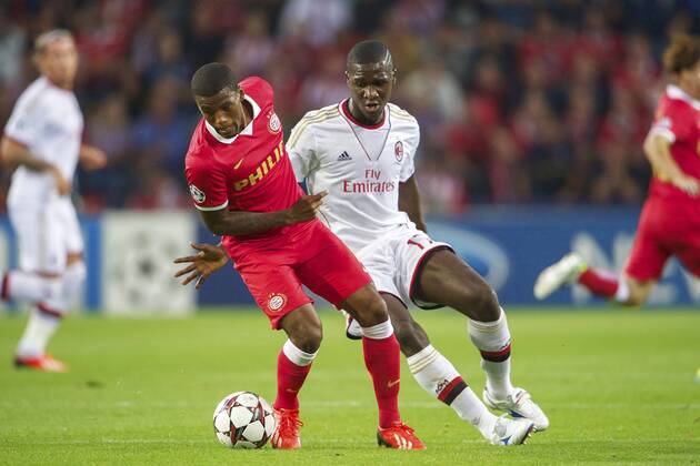 (L-R) Georginio Wijnaldum of PSV, Cristian Zapata of AC Milan during the Champions League qualifier match between PSV and AC Milan at Philips stadium on August 20, 2013 in Eindhoven, The Netherlands. PSV v AC Milan Qualifier Champions League 2013 2014 xVIxxIVx 1739639