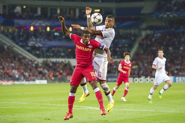 (L-R) Georginio Wijnaldum of PSV. Kevin-Prince Boateng of AC Milan during the Champions League qualifier match between PSV and AC Milan at Philips stadium on August 20, 2013 in Eindhoven, The Netherlands. PSV v AC Milan Qualifier Champions League 2013 2014 xVIxxIVx 1739680