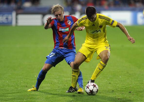 Frantisek Rajtoral (left, Pilsen) and Mitja Viler (Maribor) during the FC Viktoria Plzen vs NK Maribor first leg match of Champions League, 4th preliminary round, in Pilsen, Czech Republic, August 20, 2013. (CTKxPhoto PetrxEret) CTKPhotoP201308200759301  ert 9