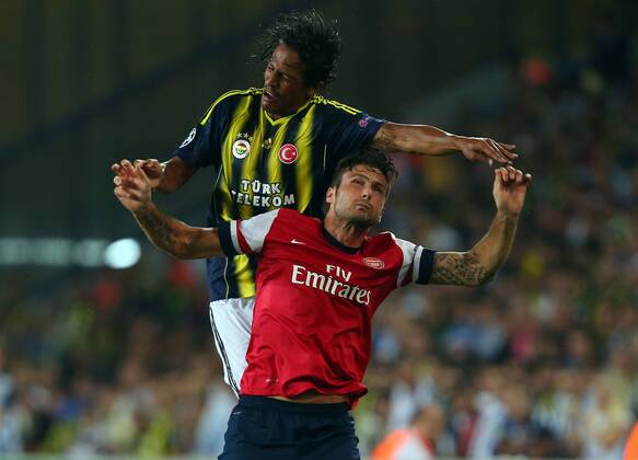 UEFA Chanpions League playoff first leg match between Fenerbahce and Arsenal at Sukru Saracoglu Stadiým in Istanbul, Turkey on august 21, 2013. Pictured: Olivier Giroud of Arsenal and Bruno Alves of Fenerbahce. 