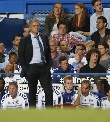 Chelsea s Fernando Torres dropped from the squad watches the match behind Jose Mourinho Chelsea v Aston Villa - Barclays Premiership - Stamford Bridge - London - England -21 08 2013 - Pic David Klein Sportimage EDITORIAL USE ONLY. No use with unauthorised audio, video, data, fixture lists, club league logos or live services. Online in-match use limited to 120 images, no video emulation. No use in betting, games or single club league player publications.