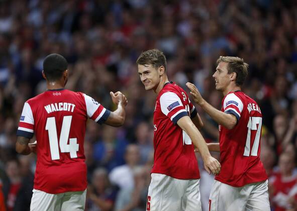 Arsenal s Aaron Ramsey celebrates scoring his sides opening goal Arsenal FC London v Fenerbahce istanbul - UEFA Champions League - Play-off Second Leg - Emirates Stadium - London - England -27 08 2013 - EDITORIAL USE ONLY. No use with unauthorised audio, video, data, fixture lists, club league logos or live services. Online in-match use limited to 120 images, no video emulation. No use in betting, games or single club league player publications.