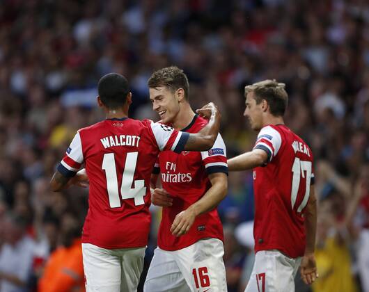 Arsenal s Aaron Ramsey celebrates scoring his sides opening goal Arsenal FC London v Fenerbahce istanbul - UEFA Champions League - Play-off Second Leg - Emirates Stadium - London - England -27 08 2013 - EDITORIAL USE ONLY. No use with unauthorised audio, video, data, fixture lists, club league logos or live services. Online in-match use limited to 120 images, no video emulation. No use in betting, games or single club league player publications.