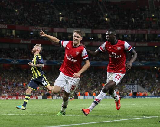 Arsenal s Aaron Ramsey celebrates scoring his sides second goal Arsenal v Fenerbahce - UEFA Champions League - Play-off Second Leg - Emirates Stadium - London - England -27 08 2013 - Pic David Klein Sportimage EDITORIAL USE ONLY. No use with unauthorised audio, video, data, fixture lists, club league logos or live services. Online in-match use limited to 120 images, no video emulation. No use in betting, games or single club league player publications.