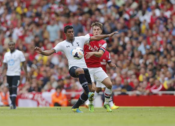 Arsenal s Aaron Ramsey tussles with Tottenham s Paulinho Arsenal v Tottenham Hotspur - Barclays Premier League - Emirates Stadium - London - England -01 09 2013 - Pic David Klein Sportimage EDITORIAL USE ONLY. No use with unauthorised audio, video, data, fixture lists, club league logos or live services. Online in-match use limited to 120 images, no video emulation. No use in betting, games or single club league player publications.
