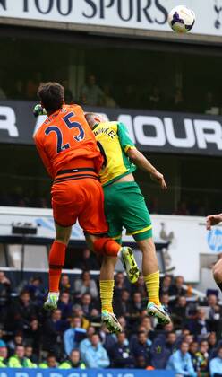 Tottenham Hotspur v Norwich City . . London, UK . . 14.09.2013 Hugo Lloris (TH) clatters into Ricky van Wolfswinkel (NC)