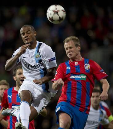 Yaya Toure (left) of Manchester City and David Limbersky of Viktoria Plzen during the Champion s League Group D soccer match Viktoria Plzen vs Manchester City, Pilsen, Czech Republic, September 17, 2013. (CTKxPhoto MichalxKamaryt) CTKPhotoP201309170863601  kmt 3