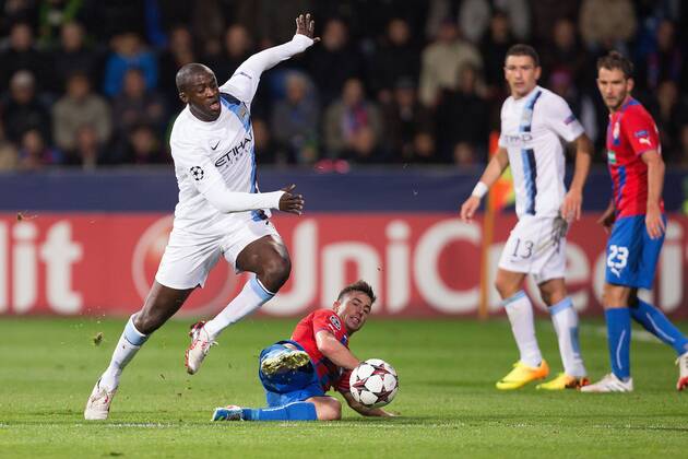Yaya Toure of Manchester City escapes a challenge from Milan Petrzela of Plzen - Viktoria Plzen vs. Manchester City - UEFA Champion s League - Doosan Arena - Plzen, Czech Republic - 17 09 2013 Pic Philip Oldham Sportimage EDITORIAL USE ONLY. No use with unauthorised audio, video, data, fixture lists, club league logos or live services. Online in-match use limited to 120 images, no video emulation. No use in betting, games or single club league player publications.
