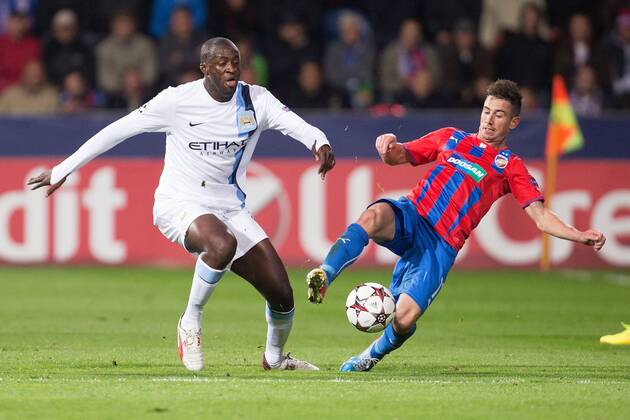 Yaya Toure of Manchester City and Milan Petrzela of Plzen in action - Viktoria Plzen vs. Manchester City - UEFA Champion s League - Doosan Arena - Plzen, Czech Republic - 17 09 2013 Pic Philip Oldham Sportimage EDITORIAL USE ONLY. No use with unauthorised audio, video, data, fixture lists, club league logos or live services. Online in-match use limited to 120 images, no video emulation. No use in betting, games or single club league player publications.