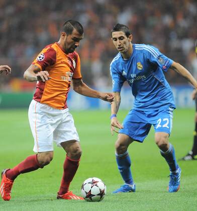 UEFA Champions League group B match between Galatasaray and Real Madrid at Turk Telekom Arena Stadium on September 17, 2013 in Istanbul,Turkey. Pictured: Engin Baytar of Galatasaray and Angel Di Maria (R) of Real Madrid. 