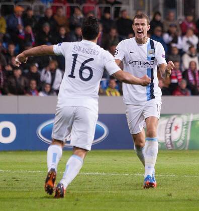 Edin Dzeko of Manchester City celebrates his opening goal - Viktoria Plzen vs. Manchester City - UEFA Champion s League - Doosan Arena - Plzen, Czech Republic - 17 09 2013 Pic Philip Oldham Sportimage EDITORIAL USE ONLY. No use with unauthorised audio, video, data, fixture lists, club league logos or live services. Online in-match use limited to 120 images, no video emulation. No use in betting, games or single club league player publications.