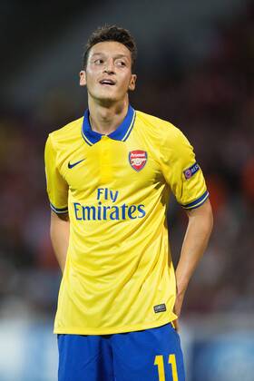 Arsenal s Mesut Ozil reacts - Olympique de Marseille vs. Arsenal FC London - UEFA Champion s League - Stade Velodrome - Marseille, France - 18 09 2013 Pic Philip Oldham Sportimage EDITORIAL USE ONLY. No use with unauthorised audio, video, data, fixture lists, club league logos or live services. Online in-match use limited to 120 images, no video emulation. No use in betting, games or single club league player publications.