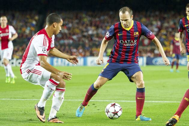 (L-R) Ricardo van Rhijn of Ajax, Andres Iniesta of FC Barcelona during the Champions League match between FC Barcelona and Ajax Amsterdam on September 18, 2013 at the Camp Nou stadium in Barcelona, Spain FC Barcelona v Ajax Champions League 2013 2014 xVIxxIVx 1796323