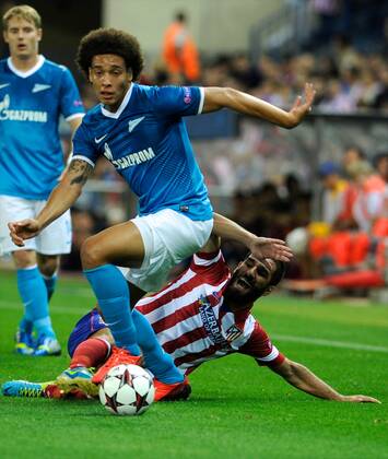 FK Zenit St. Petersburg FK Midfielder, number 28 Axel Witsel - Axel Witsel (23), Atletico de Madrid Midfielder, number 10 ARDA - Arda Turan (25) during round 1 of the Champions league, soccer match between Atletico de Madrid - FK Zenit St. Petersburg FK aGregorioxLopez. 