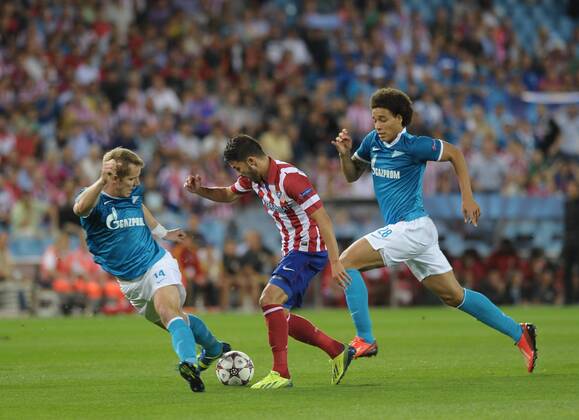 Atletico de Madrid Forward, number 9 VILLA - David Villa Sanchez (31) Tomas Hubocan and axel witsel during round 1 of the UEFA CHAMPIONS LEAGUE league, soccer match between Atletico de Madrid - Football Club Zenit St. Petersburg FK VICENTE CALDERON estadium, Madrid - MiguelxLopez. 