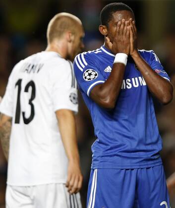 LONDON, Sept. 18, 2013 - Samuel Eto o(R) of Chelsea FC reacts during the UEFA Champions League Group E match between Chelsea FC and FC Basel 1893 at Stamford Bridge Stadium in London, Britain, on Sept. 18, 2013. Chelsea lost 1-2. (Xinhua Wang Lili) (SP)BRITAIN-LONDON-SOCCER-UEFA CHAMPIONS LEAGUE-CHELSEA FC VS FC BASEL 